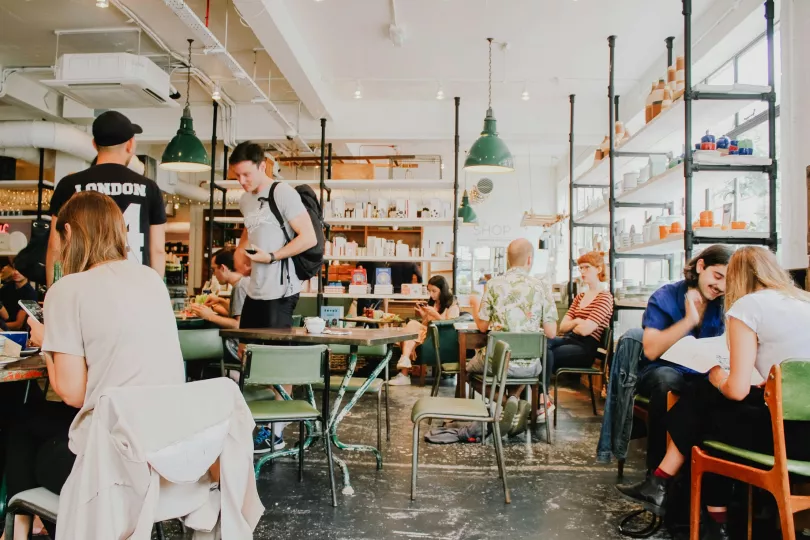 A photo of several people in a coffee shop
