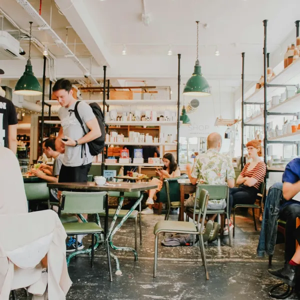 A photo of several people in a coffee shop