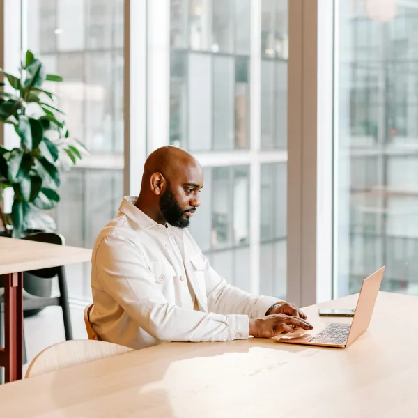 A man works on a laptop