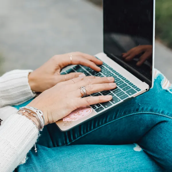 A person types on a computer
