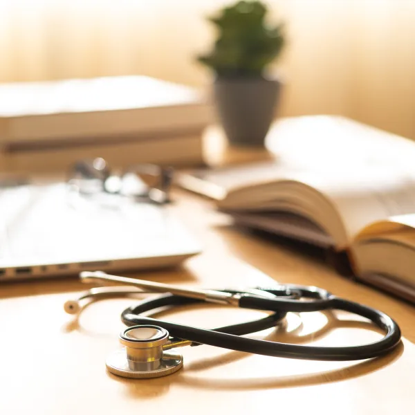 Hospital Work Environment Featuring Medical Notepad And Stethoscope