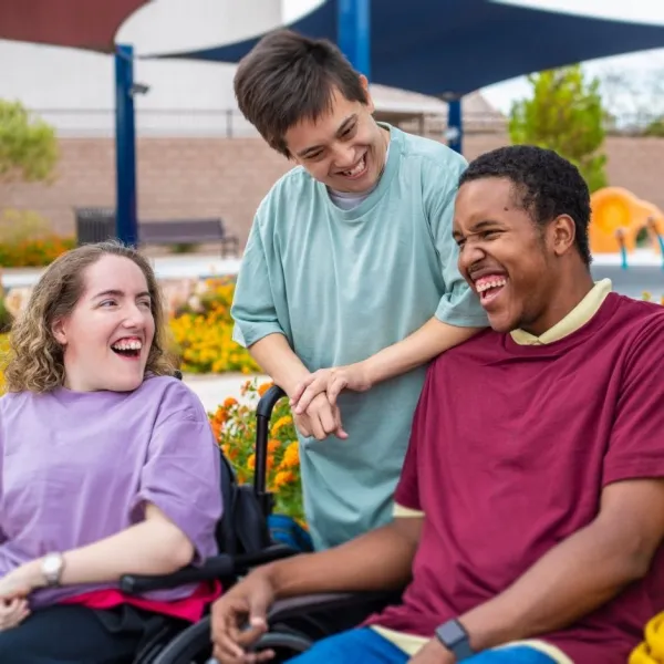 group of people with disabilitites smiling together