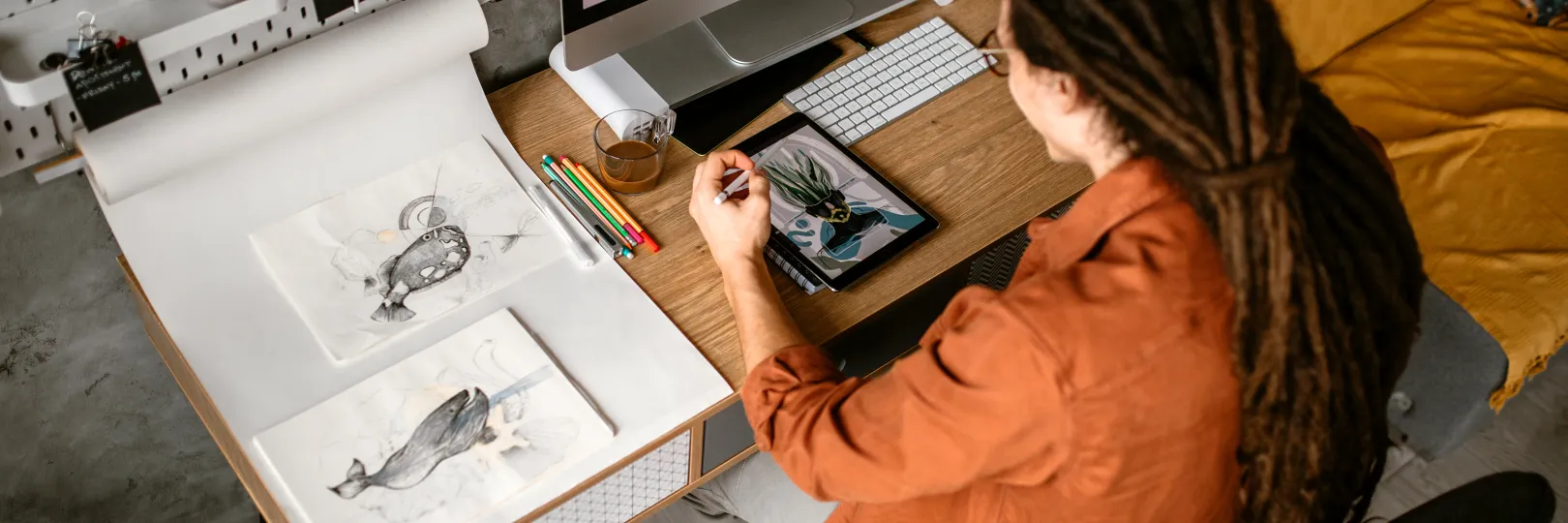 Graphic designer sketching using drawing pad stock photo